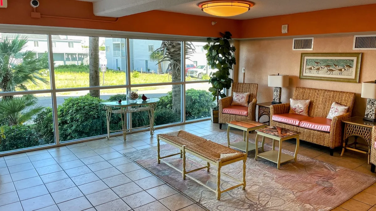 The streetside sitting area is located directly next to the elevators on the ground floor.