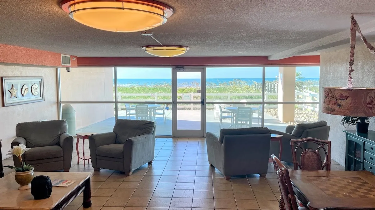 The oceanfront lounge has comfortable seating, a chess table and direct access to the outdoor patio area.